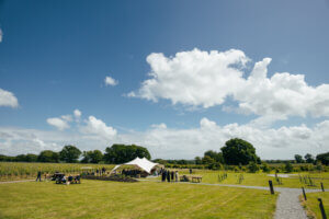 Landscape with a events tent of Gusbourne winery estate grounds, a Ten events partner